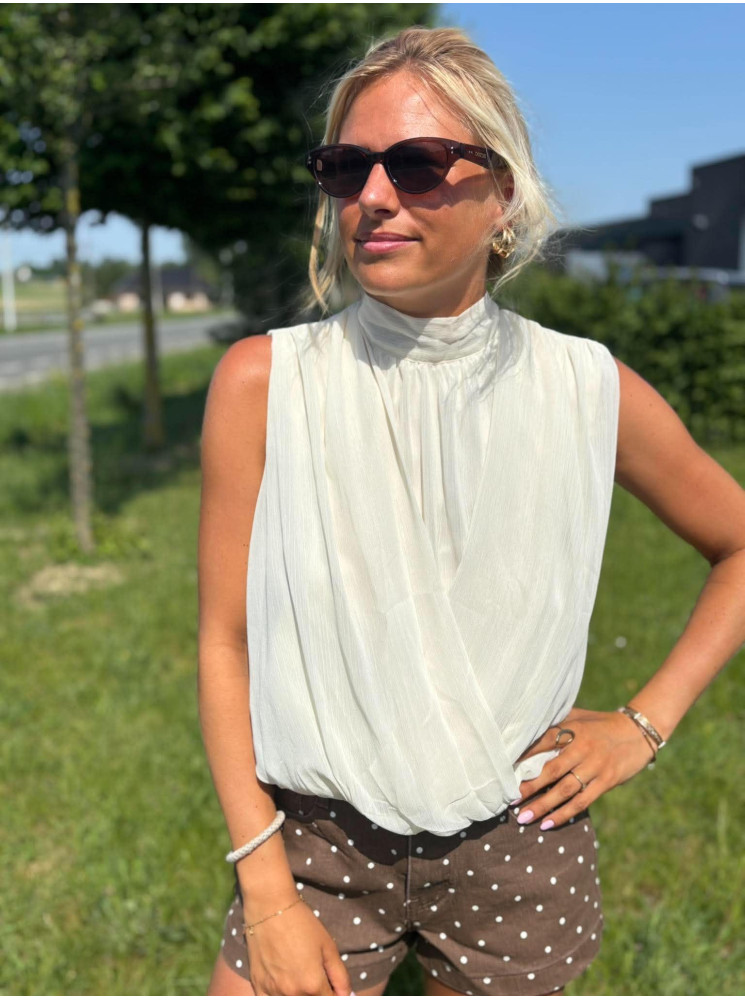 Blouse col haut sans manches