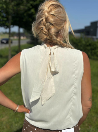 Blouse col haut sans manches